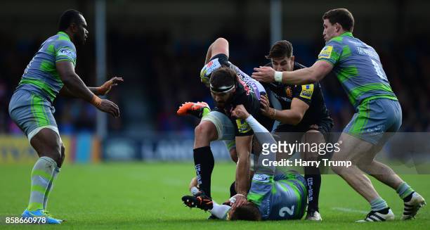 Don Armand of Exeter Chiefs is tackled by Toby Flood of Newcastle Falcons during the Aviva Premiership match between Exeter Chiefs and Newcastle...