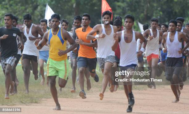 Unemployed youth take part in the physical test during a special recruitment camp of the Indian Army at Morahbadi Ground, on October 7, 2017 in...