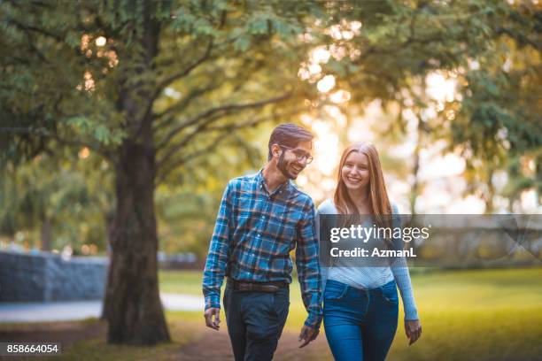 amazing moments will last forever - couple walking in park stock pictures, royalty-free photos & images