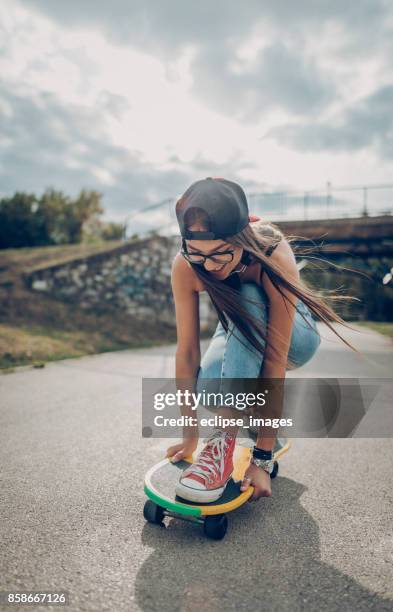 chasing the sun... - woman longboard stock pictures, royalty-free photos & images