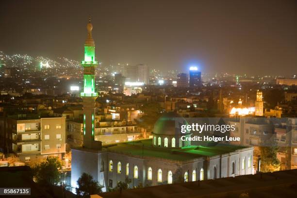 overhead view of damascus skyline at night  from le meridien damascus hotel. - ダマスカス ストックフォトと画像