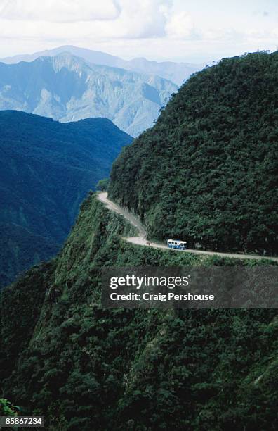 bus travelling the world's most dangerous road. - bolivia stock-fotos und bilder