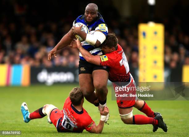 Beno Obano of Bath is tackled by Jamie Shillcock and Sam Lewis of Worcester during the Aviva Premiership match between Bath Rugby and Worcester...