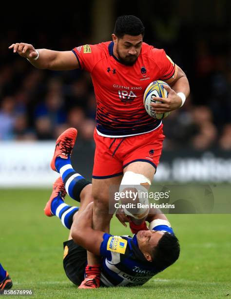 Alafoti Faosiliva of Worcester is tackled by Ben Tapuai of Bath during the Aviva Premiership match between Bath Rugby and Worcester Warriors at...