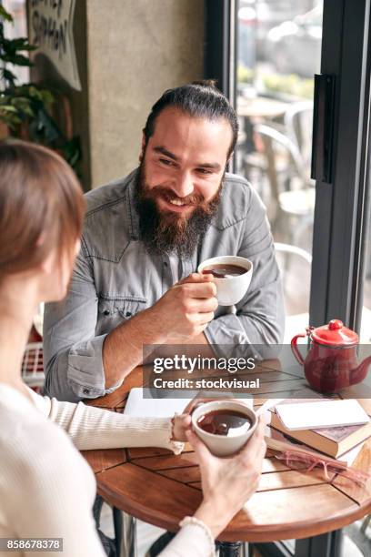 couple having coffee at cafe - coffee bike stock pictures, royalty-free photos & images