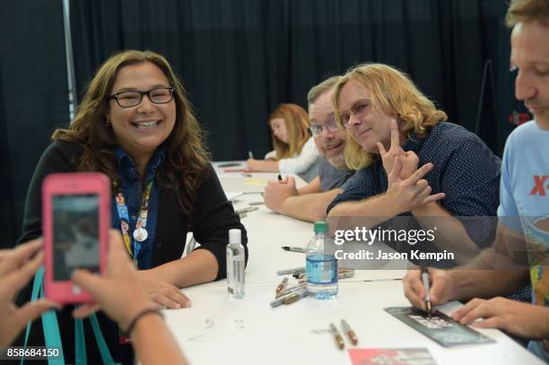 Tom Root and Tom Sheppard pose with a fan during the Robot Chicken signing during New York Comic Con 2017 - JK at Jacob K. Javits Convention Center...
