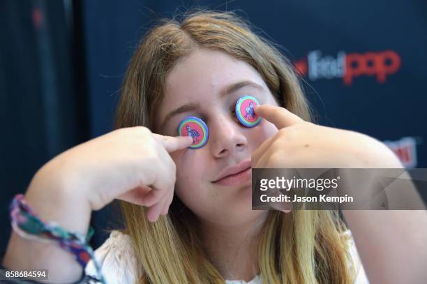 Fan pose with Robot Chicken pins during the Robot Chicken signing during New York Comic Con 2017 - JK at Jacob K. Javits Convention Center on October...