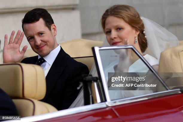 Prince Philip of Serbia, also known as Filip Karadjordjevic and his bride Danica Marinkovic leave the Belgrade cathedral after their wedding ceremony...