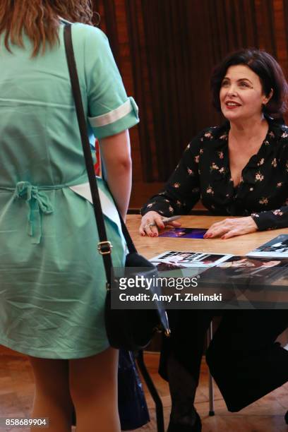 Actress Sherilyn Fenn, who played Audrey Horne in the show Twin Peaks, talks to a fan in costume as an RR waitress during the Twin Peaks UK Festival...