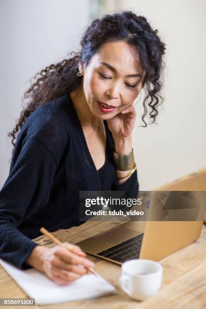 a woman writing - tdub_video stock pictures, royalty-free photos & images