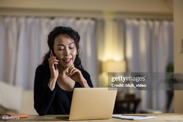 a woman taking on the phone - tdub_video stock pictures, royalty-free photos & images