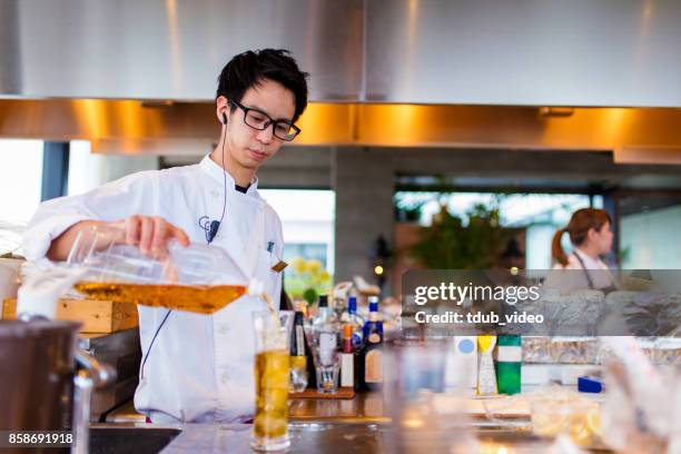 a man working at a restaurant - tdub_video stock pictures, royalty-free photos & images