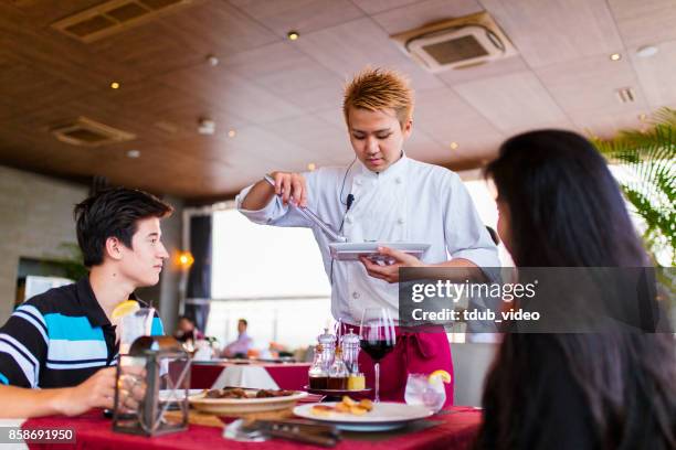 people at a restaurant - tdub_video stock pictures, royalty-free photos & images