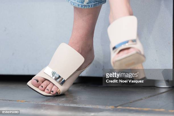 Kathryn Hahn, shoe detail, visits 'Extra' at Universal Studios Hollywood on October 5, 2017 in Universal City, California.