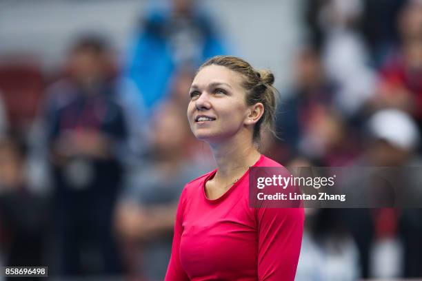 Simona Halep of Romania celebrates after winning the Women's Singles Semifinals match against Jelena Ostapenko of Latvia on day eight of 2017 China...