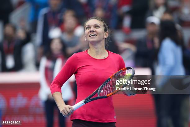 Simona Halep of Romania celebrates after winning the Women's Singles Semifinals match against Jelena Ostapenko of Latvia on day eight of 2017 China...