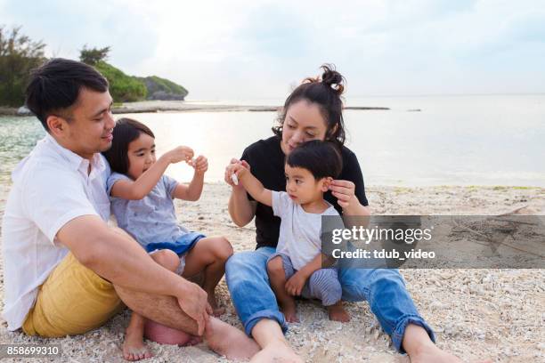 family at the beach - tdub_video stock pictures, royalty-free photos & images