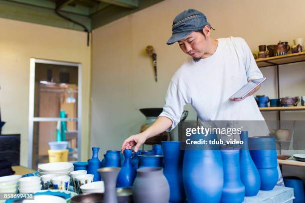 pottery at okinawa - tdub_video stock pictures, royalty-free photos & images