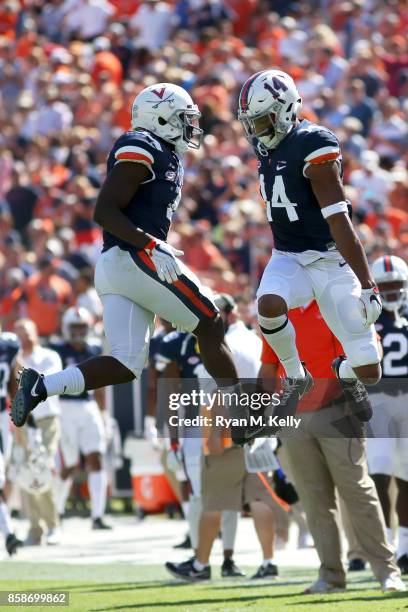 Olamide Zaccheaus and Andre Levrone of the Virginia Cavaliers celebrate a touchdown during a game against the Duke Blue Devils at Scott Stadium on...