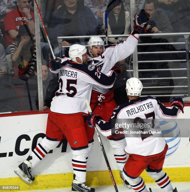 Rick Nash of the Columbus Blue Jackets celebrates his game-tying goal in the third period against the Chicago Blackhawks with teammates Jason Chimera...