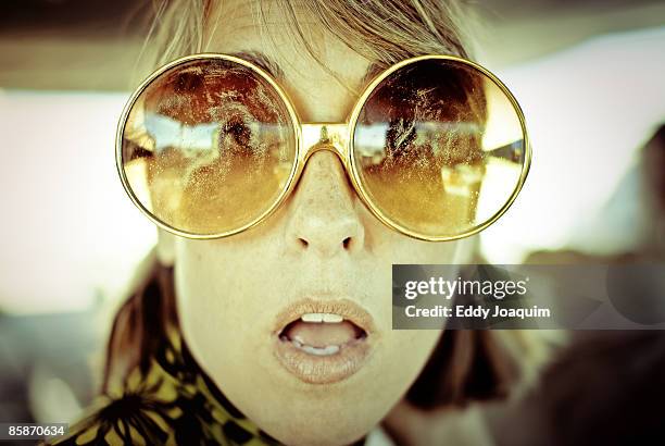 woman wearing sunglasses - think big stock pictures, royalty-free photos & images