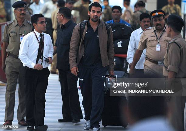 Indian cricketer Zaheer Khan walks out of the city airport after arriving from New Zealand in Mumbai late April 8, 2009. The Indian cricket team...