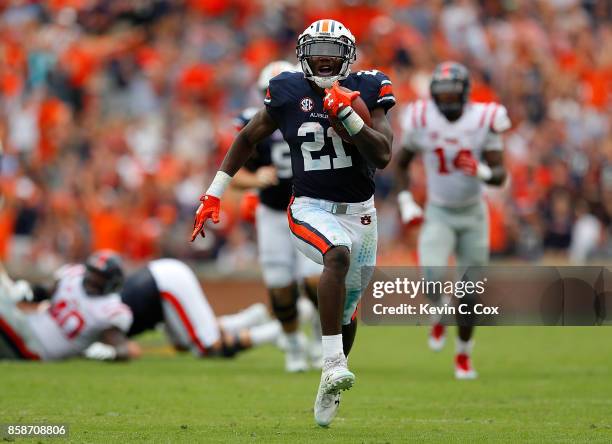 Kerryon Johnson of the Auburn Tigers rushes for a touchdown against the Mississippi Rebels at Jordan Hare Stadium on October 7, 2017 in Auburn,...