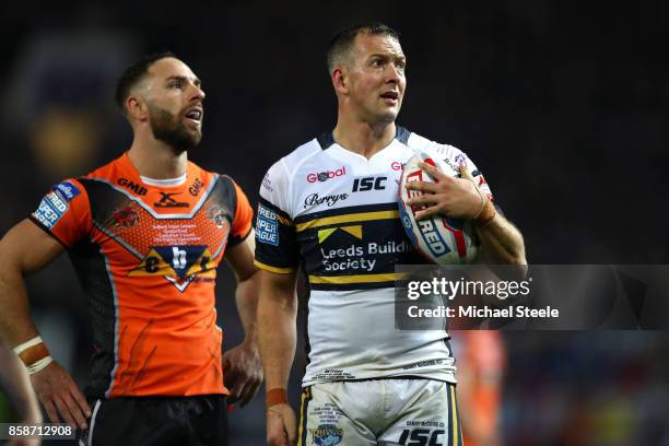 Danny McGuire of Leeds Rhinos watches the big screen for a decision with Luke Gale of Castleford Tigers during the Betfred Super League Grand Final...