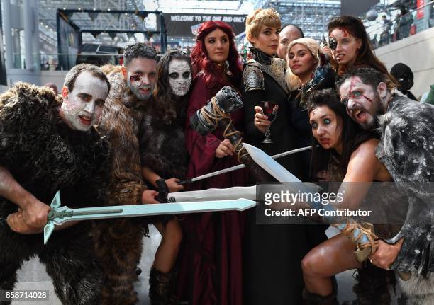 Comic Con fans dressed up as characters from the TV show "Game of Thrones" arrive for the 3rd day of the 2017 New York Comic Con at the Jacob Javits...