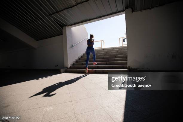 woman running - inside of train stock pictures, royalty-free photos & images