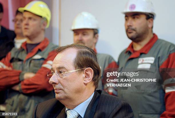 The director of the Florange plant of the steel giant ArcelorMittal, Henri Blaffart , speaks to steel workers after they burst into a...