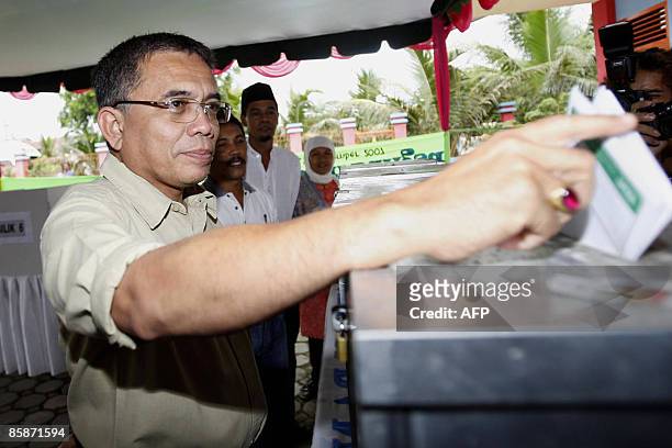Aceh Governor Irwandi Yusuf cast his ballot at a polling center in Banda Aceh on April 9, 2009. Elections in Aceh went ahead peacefully following the...