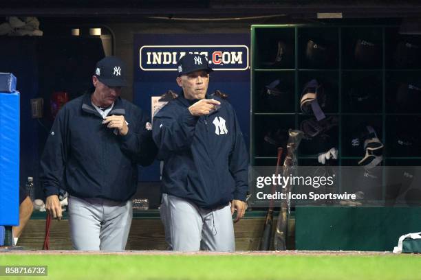 New York Yankees manager Joe Girardi signals home plate umpire Dan Iassogna that he did not want a video review of the play where Cleveland Indians...