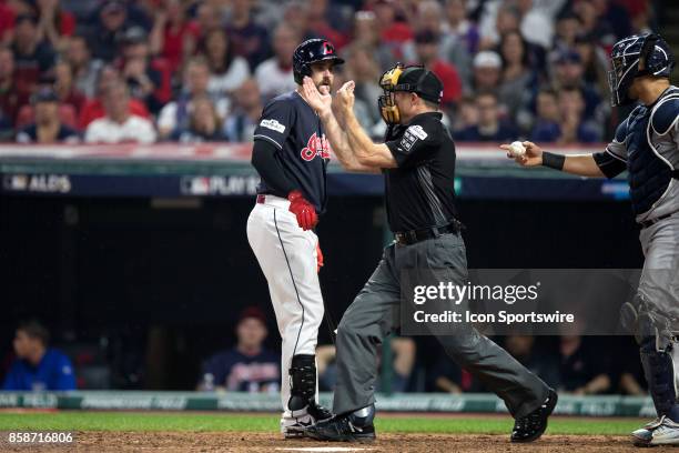Home plate umpire Dan Iassogna signals that Cleveland Indians outfielder Lonnie Chisenhall was hit by a pitch to load the bases during the sixth...