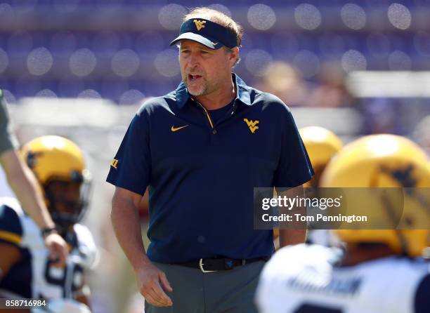 Head coach Dana Holgorsen of the West Virginia Mountaineers looks on as the West Virginia Mountaineers prepare to take on the TCU Horned Frogs at...