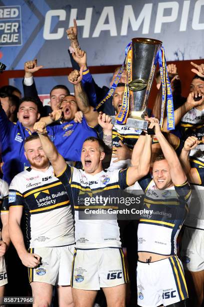 Danny McGuire of Leeds Rhinos lifts the trophy with his team-mates at the end of the Betfred Super League Grand Final match between Castleford Tigers...