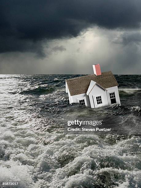 house floating under water in stormy conditions - under sink foto e immagini stock