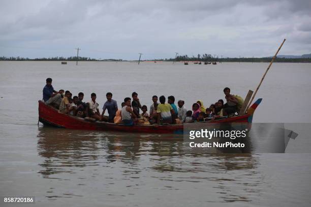 Rohingya people, fled from ongoing military operation in Myanmar Rakhain state, ride on boat at Shah Pori Island to go to refugee camp in Shah Pori...
