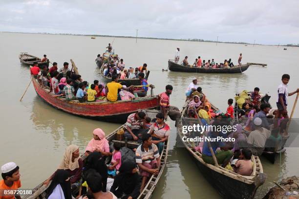 Rohingya people, fled from ongoing military operation in Myanmar Rakhain state, ride on boat at Shah Pori Island to go to refugee camp in Shah Pori...