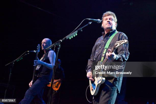 Ali McMordie and Jake Burns Stiff Little Fingers perform on stage at the Forum on April 3, 2009 in London, England.