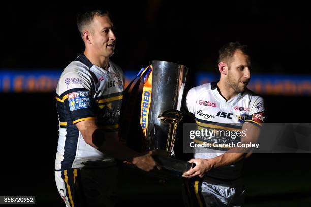 Danny McGuire and Rob Burrow of Leeds Rhinos hold the trophy at the end of the Betfred Super League Grand Final match between Castleford Tigers and...