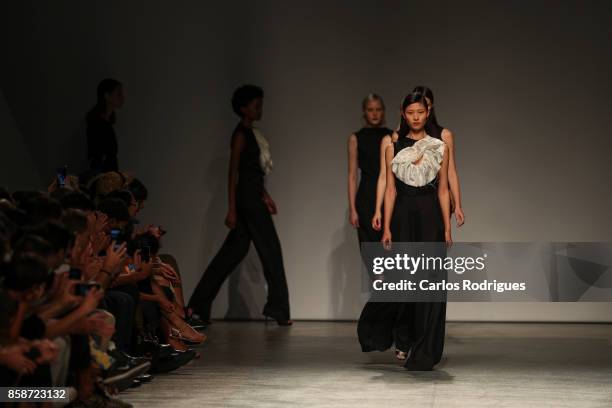 Model runs the catwalk during Aleksandar Protic runway show on October 7, 2017 in Lisboa CDP, Portugal.