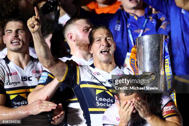 Danny McGuire and Rob Burrow of Leeds Rhinos celebrate with the trophy and their team-mates at the end of the Betfred Super League Grand Final match...