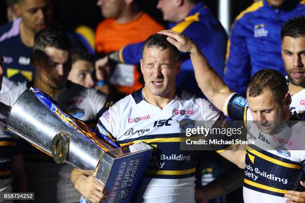 Danny McGuire and Rob Burrow of Leeds Rhinos celebrate with the trophy and their team-mates at the end of the Betfred Super League Grand Final match...