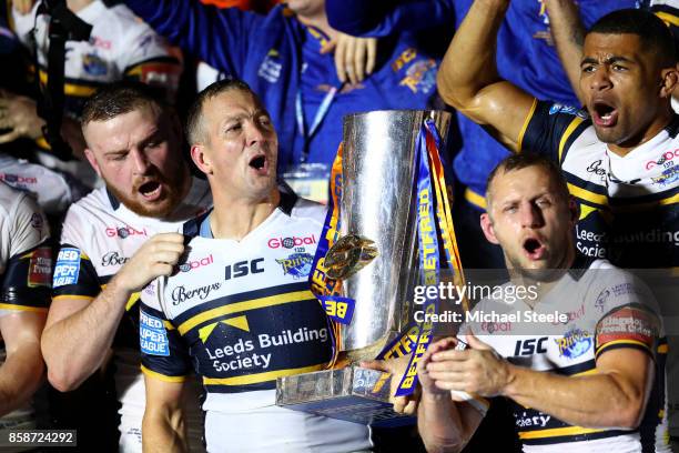 Danny McGuire and Rob Burrow of Leeds Rhinos celebrate with the trophy and their team-mates at the end of the Betfred Super League Grand Final match...