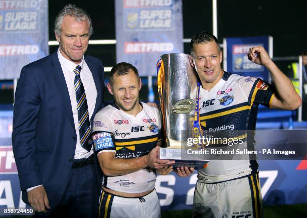 Leeds Rhinos coach Brian McDermott , Rob Burrow and Danny McGuire celebrate with the trophy after the final whistle during the Betfred Super League...