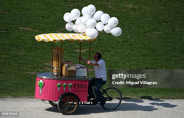 An iceman drives around with his mobile ice store on wheels in the Englischer Garten on April 9, 2009 in Munich, Germany. Bavaria is enjoying the...