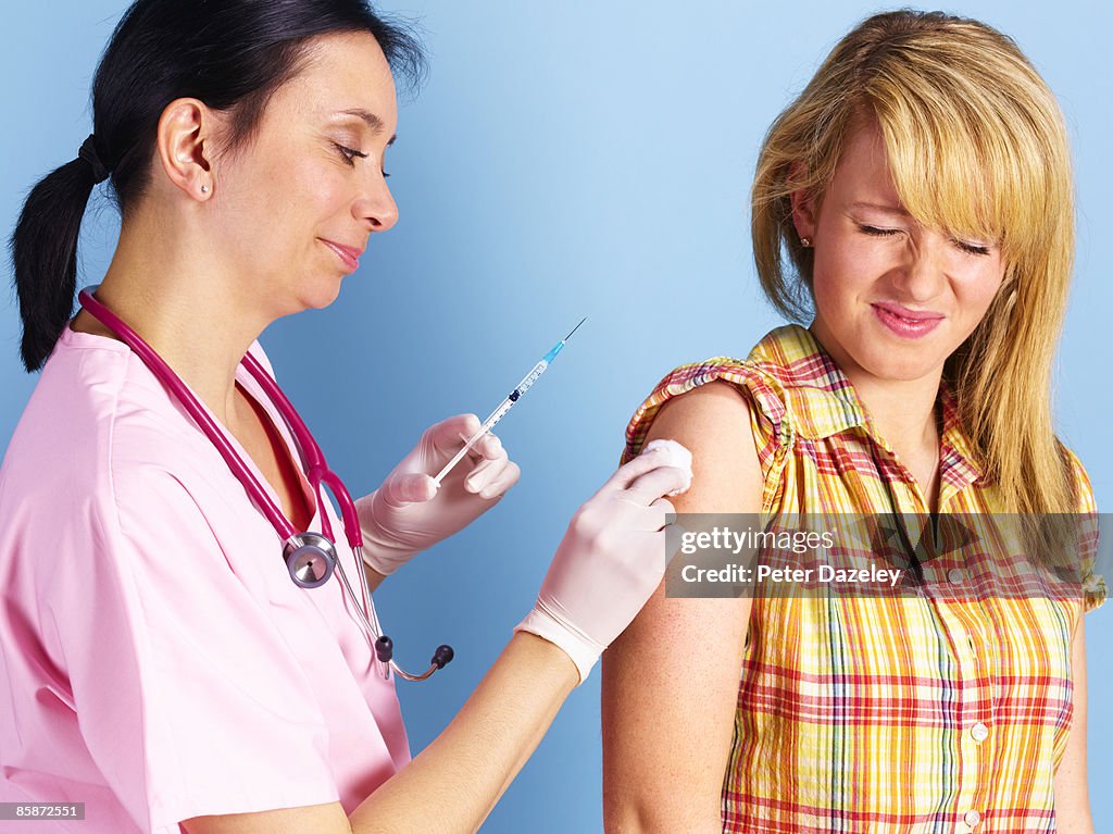 Patient receiving allergy, vacation vaccination.
