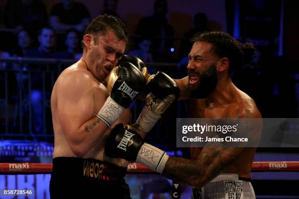 Luke Watkins of England punches Robin Dupre of England during there Commonwealth Cruiserweight Title fight at York Hall on October 7, 2017 in London,...