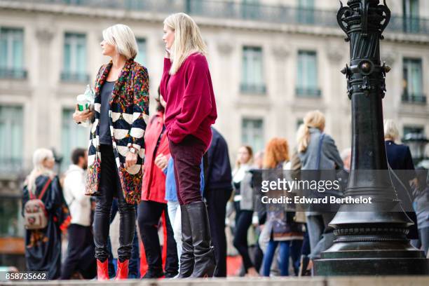 Guest wears a pink top, black leather boots, outside Stella Mccartney, during Paris Fashion Week Womenswear Spring/Summer 2018, on October 2, 2017 in...